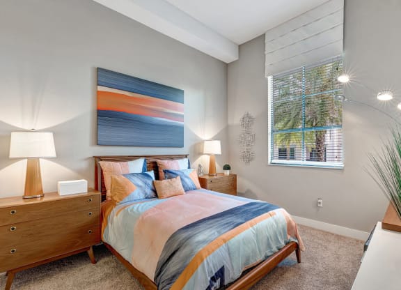 a bedroom with a large bed and a window
