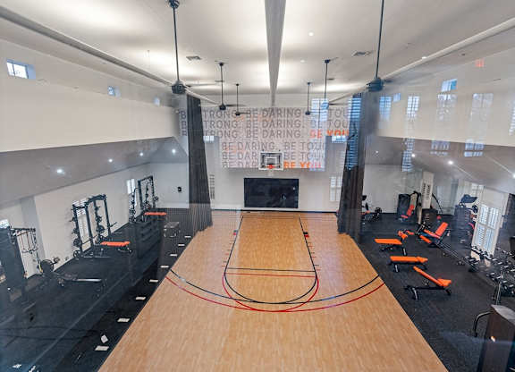 Expansive fitness center with basketball court