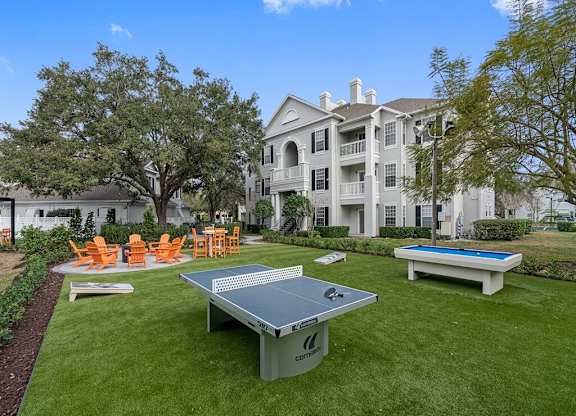 Outdoor amenity area with Ping Pong, Pool table, fire pit and seating