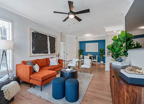 Spacious living room area with furniture and plank flooring