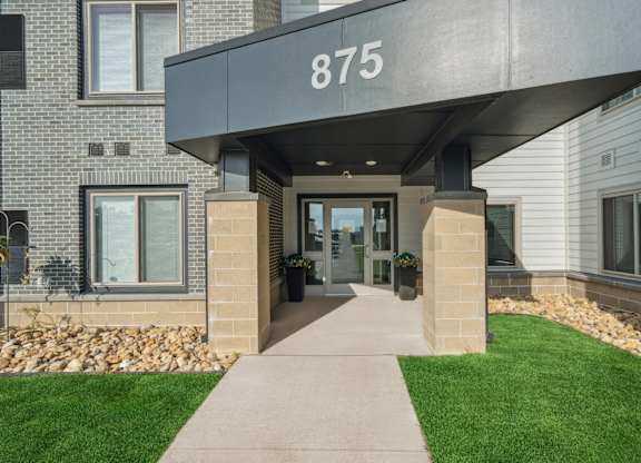 The front of a building with the number 875 on it.