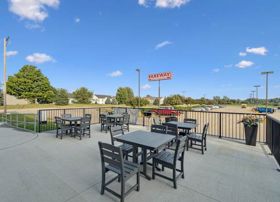A patio with tables and chairs is set up for outdoor dining.