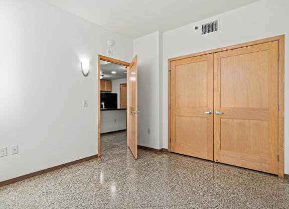A kitchen area with a countertop and cabinets.