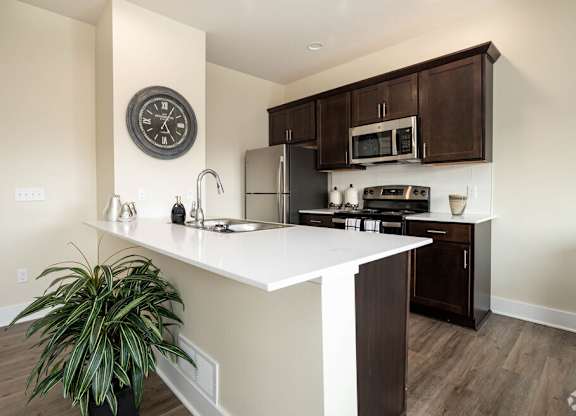 Kitchen with white countertop at Hathaway Meadows, Farmington, NY, 14425