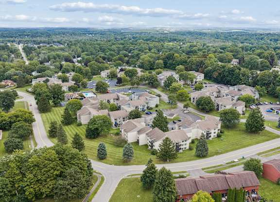 A bird's eye view of a residential neighborhood with houses and trees.