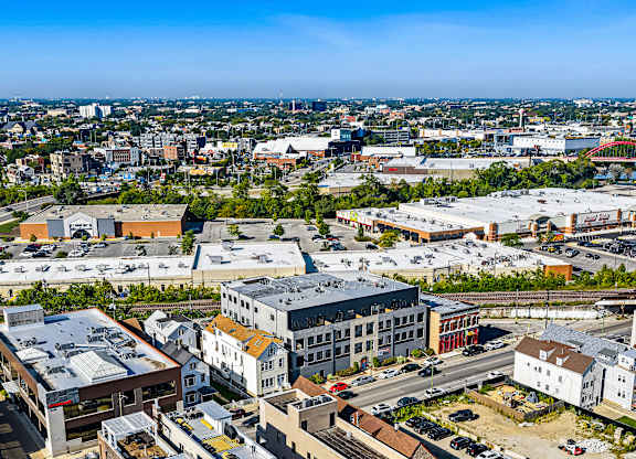 A cityscape with buildings and a clear sky.