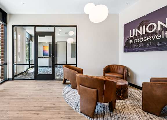A room with brown chairs and a sign that says "UNION".