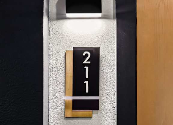 A door with a number 211 on it.