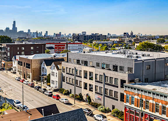 A city street with cars and buildings.