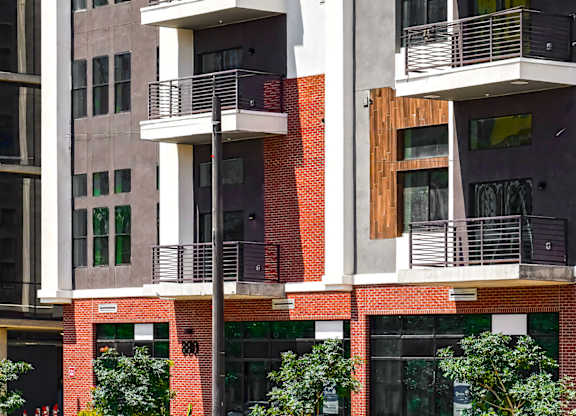 A modern building with balconies and windows.
