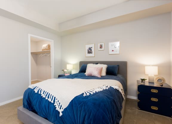 Carpeted Bedroom With Walk-In Closet At Union at Roosevelt Apartments In Phoenix, AZ
