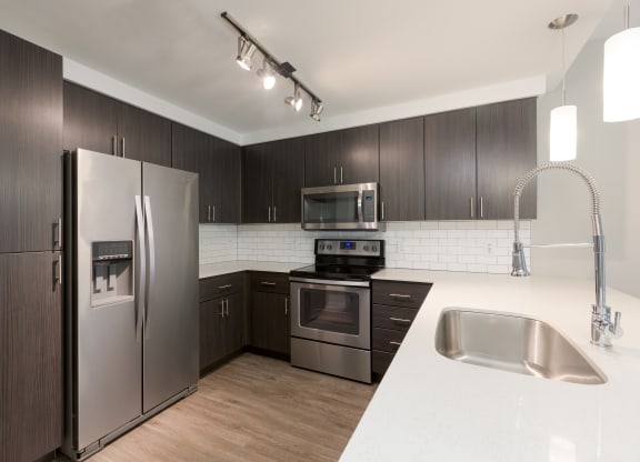 Stainless Steel Appliances And Modern Cabinetry At Union at Roosevelt Apartments In Phoenix, AZ