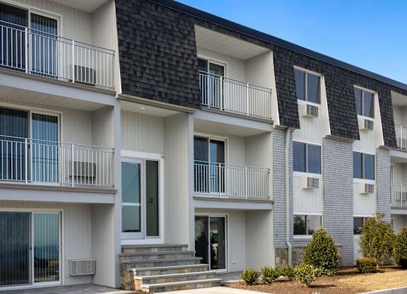 Exterior view of building with bushes and a sidewalk at 151 Ocean Road LLC, Narragansett, RI, Rhode