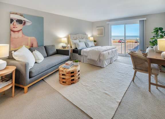 Cozy Bedroom with wide windows and carpeting at 151 Ocean Road LLC, Narragansett, RI, 02882