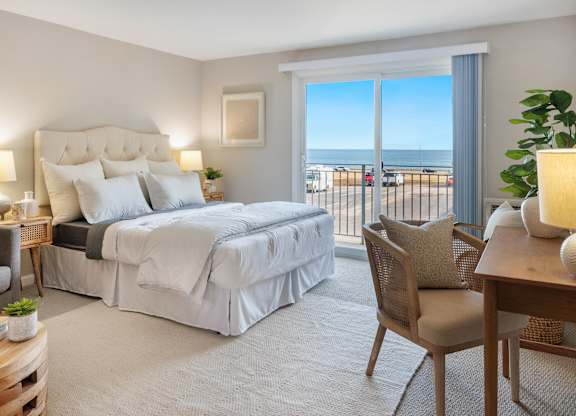 Cozy Bedroom with a bed and a view of the ocean at 151 Ocean Road LLC, Narragansett, 02882