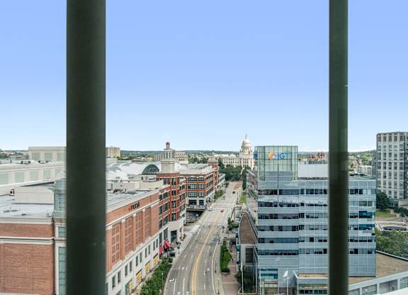 A cityscape viewed from a high vantage point with buildings and a clear sky at Residences Providence, Providence, Rhode Island