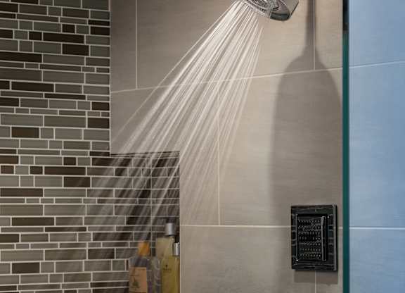 A shower head with water flowing from it at Residences Providence, Providence