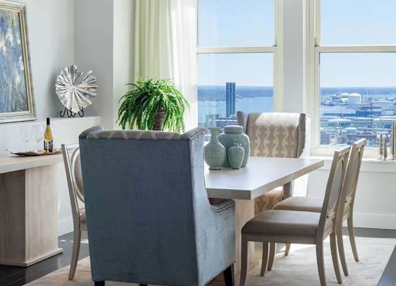 A dining room with a table and chairs at Residences Providence, Providence, RI