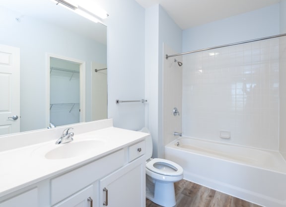 Drum Hill 2 Bedroom Apartment bathroom with bright white finishes.