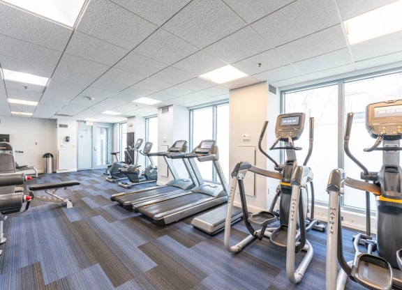 50 WB's gym with cardio equipment and weights in a building with windows