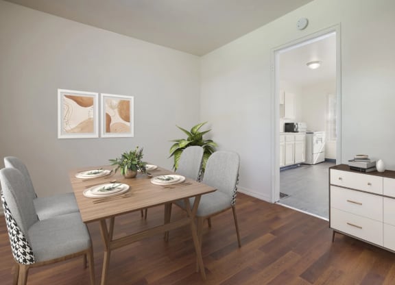 a dining room with a table and chairs