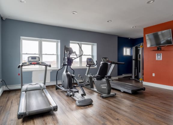 the gym at the district flats apartments in lenexa