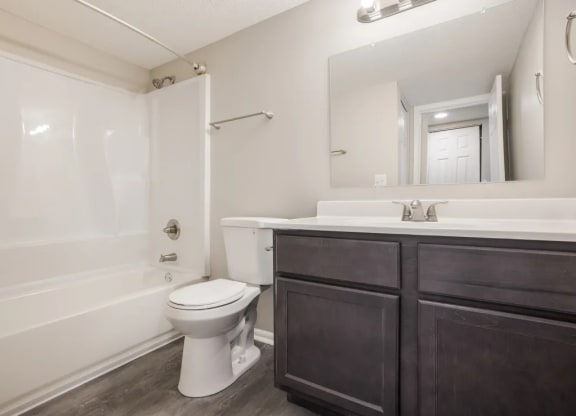 a bathroom with a toilet sink and bathtub