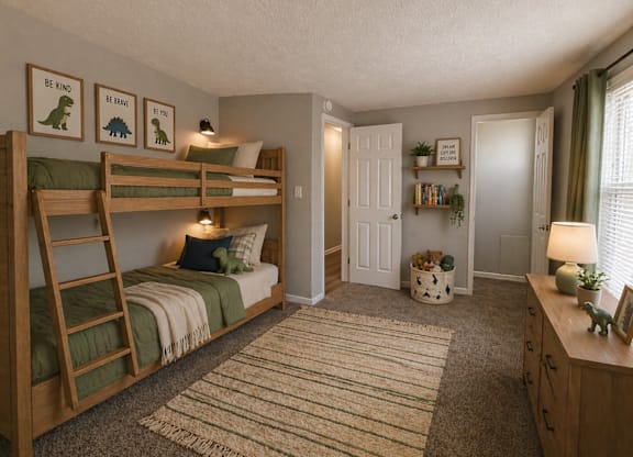 A bedroom with two bunk beds and a rug on the floor.