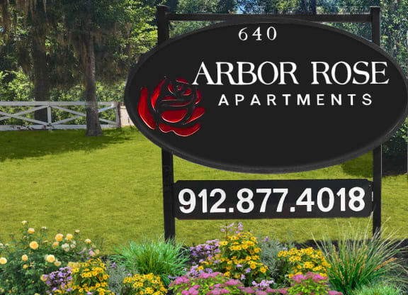 a sign that reads arbor roses apartments