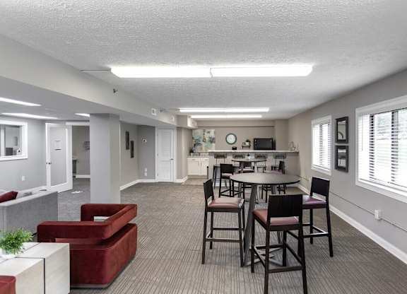 A large open room with a table and chairs.