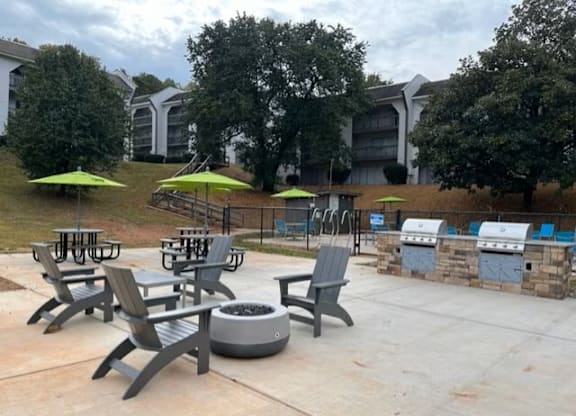 A patio with chairs and tables is set up.