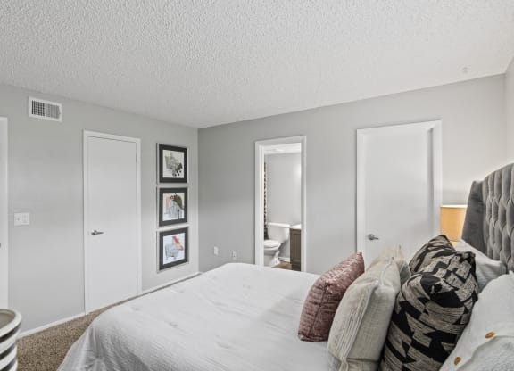our apartments offer a bedroom with a large bed and a bathroom