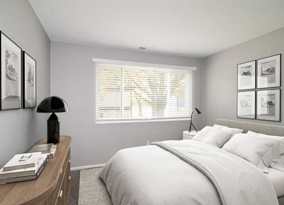 a white bedroom with a large bed and a window