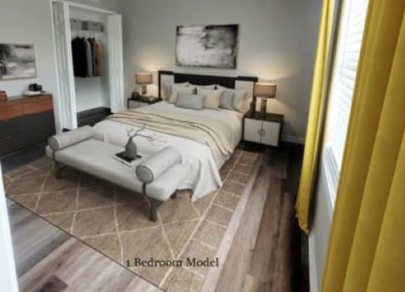 Hardwood-style flooring bedroom with a bed in between two nightstands, a closet, and a window.  