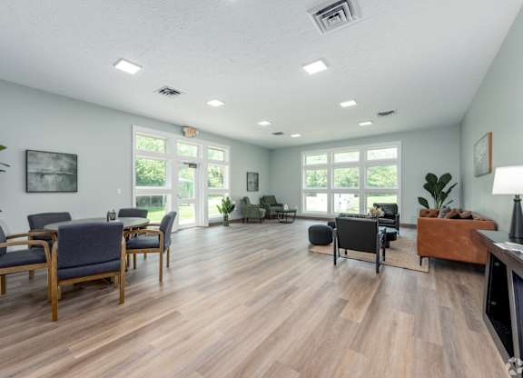 A living room with wooden floors and furniture.