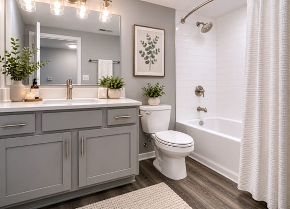 A bathroom with a white toilet and a white shower curtain.