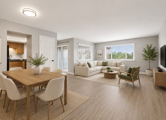 A modern living room with a dining table and chairs.