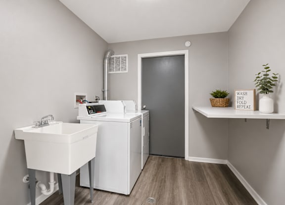 A laundry room with a washer and dryer.