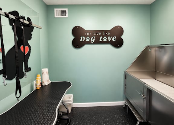 A dog grooming station with a sign that says "I love you like dog love".