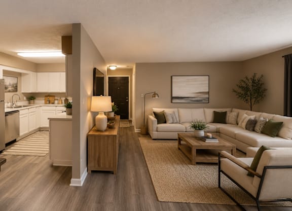 A modern kitchen with a dining table and a couch.