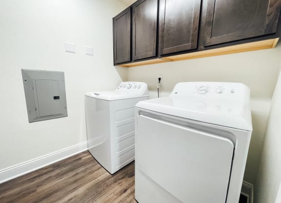 the private laundry room of our studio apartment atrium has a washer dryer