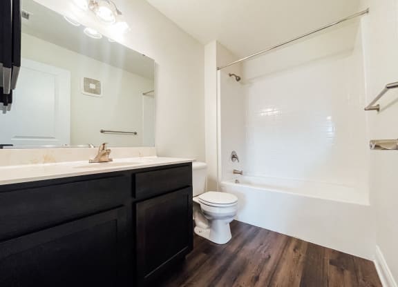 an empty bathroom with a toilet and a sink