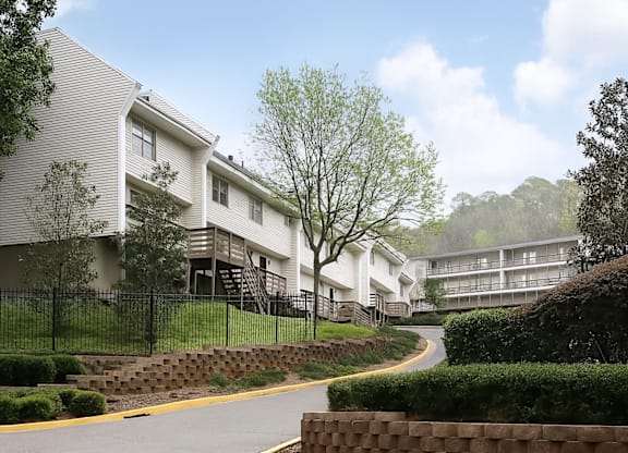 A residential area with houses and a curved road.