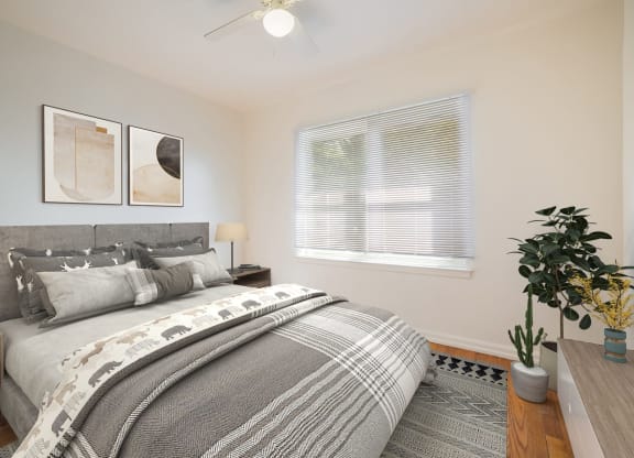 a bedroom with a bed and a window