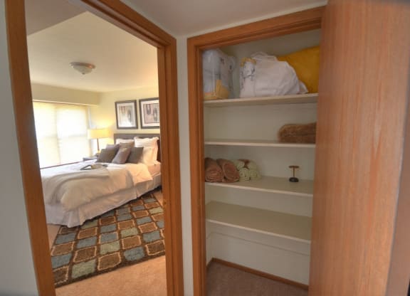 Hallway closet with shelves
