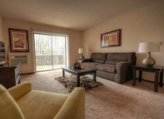 a living room with a couch and a tv
