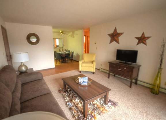 a living room with a couch and a coffee table