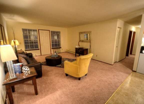 a living room with a couch and a chair