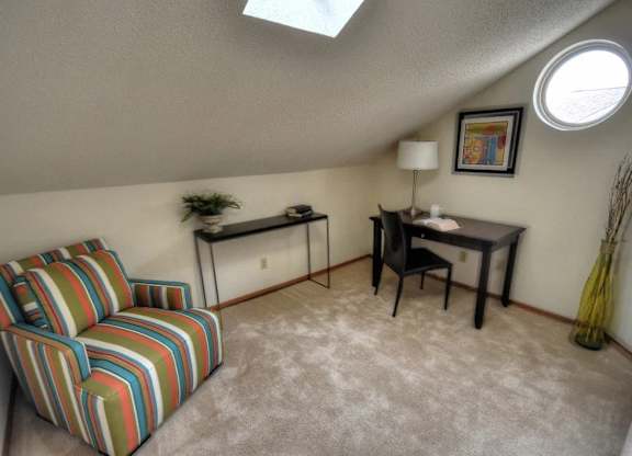 a living room with a couch and a table