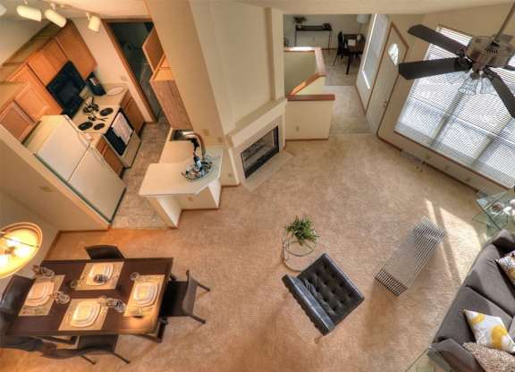 an overhead view of a living room with a ceiling fan